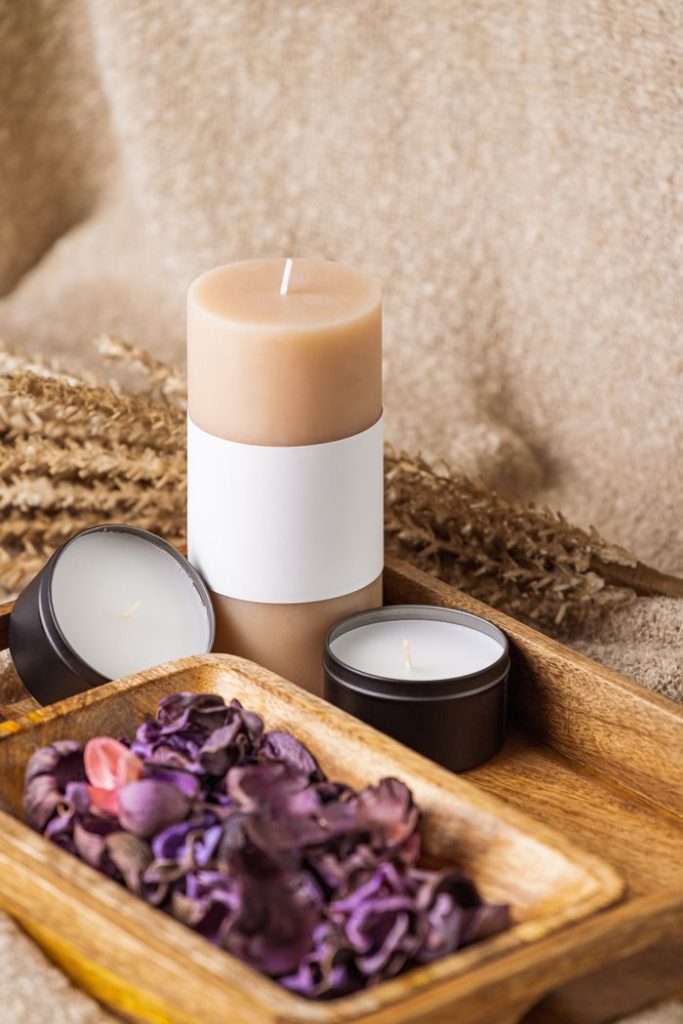 Warm and calming candle setup with potpourri on a wooden tray. Perfect for relaxation and home decor.